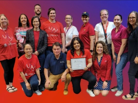 Nellie Rios surrounded by Math Staff